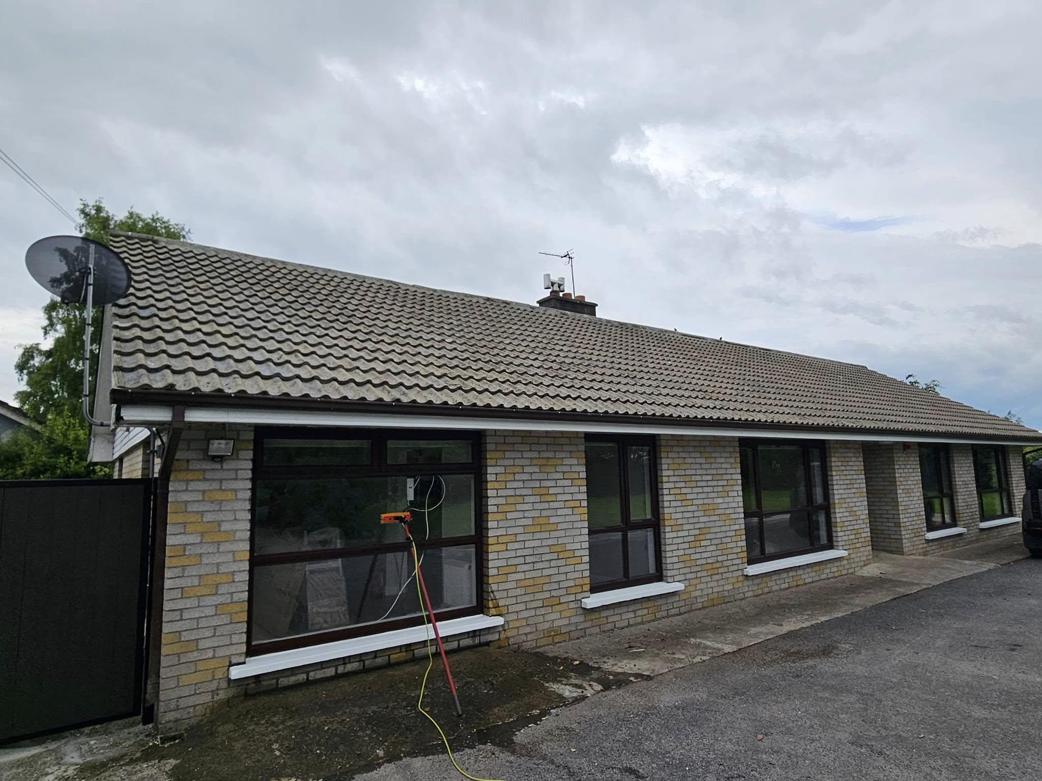 house roof being cleaned in Tipperary using a telescopic cleaner