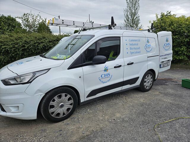 image of the modern roofing van with logos and writing on the side.